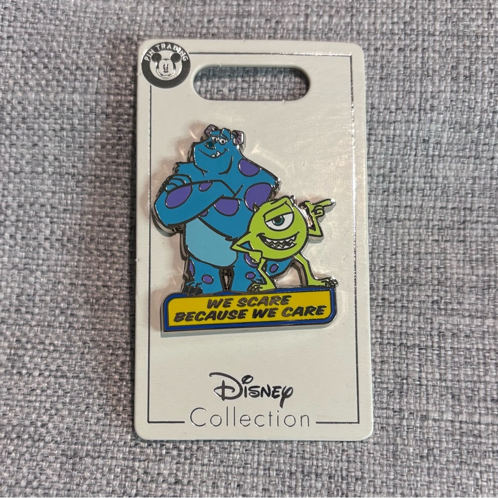 Monsters Inc. We Scare Because We Care Enamel Pin